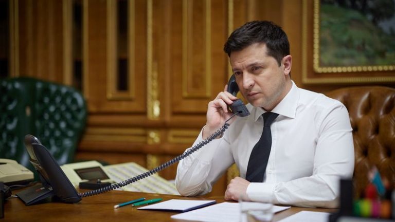 FILE PHOTO: Ukraine's President Volodymyr Zelenskiy speaks by phone with U.S. President Joe Biden in Kyiv