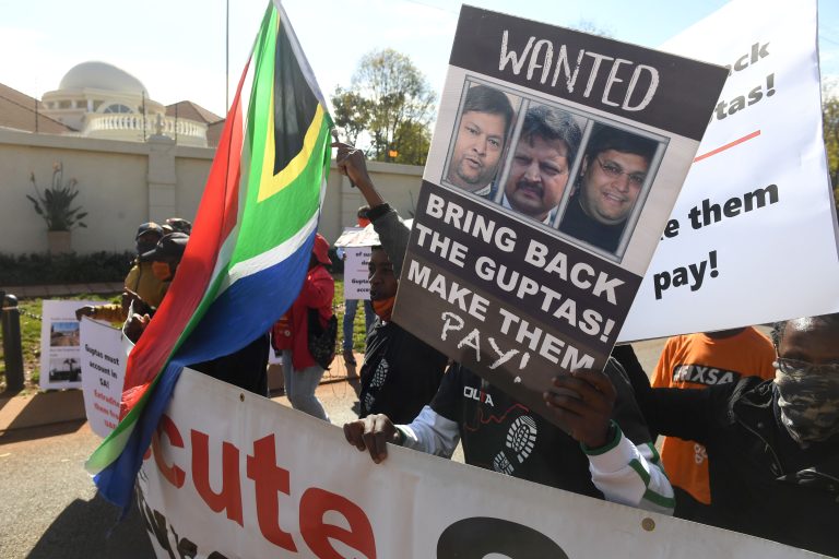 Protesters in South Africa demand the extradition of the Guptas at UAE Embassy